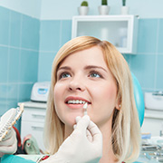 Girl having teeth checked for whiteness